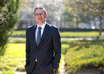 uc irvine researcher diego pizzagalli phd standing outside wearing a suit